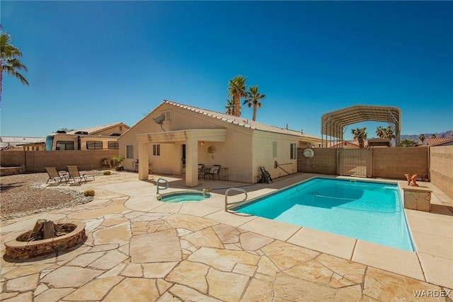 view of pool featuring a fenced in pool, an outdoor fire pit, a fenced backyard, a patio area, and an in ground hot tub