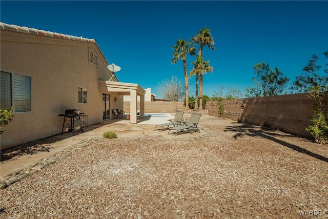 view of yard featuring a patio and a fenced backyard