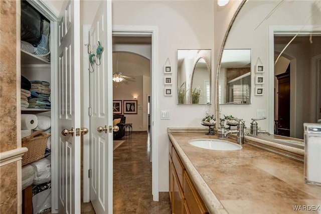 bathroom featuring vanity and a ceiling fan