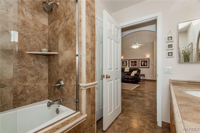 ensuite bathroom with shower / bathing tub combination, ensuite bathroom, ceiling fan, and vanity