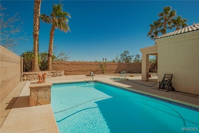 view of swimming pool featuring a patio area, a fenced backyard, and a fenced in pool