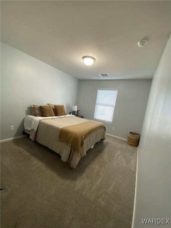 bedroom featuring baseboards, carpet floors, and visible vents