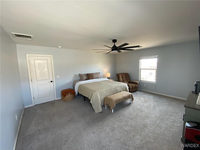 carpeted bedroom with a ceiling fan, baseboards, and visible vents