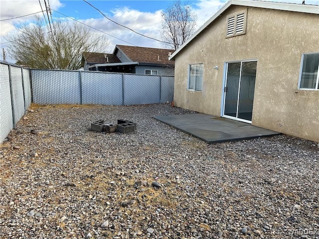 view of yard with a fenced backyard and a patio