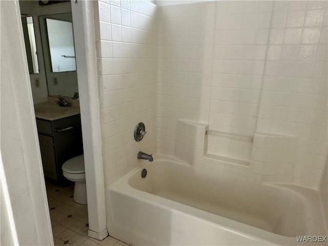 full bathroom featuring toilet, vanity, shower / washtub combination, and tile patterned floors