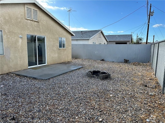 view of yard featuring a patio area and a fenced backyard