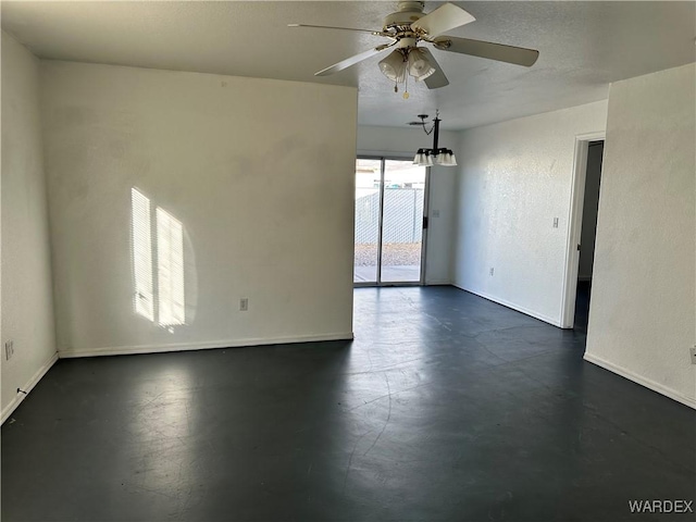 spare room featuring ceiling fan, baseboards, and a textured wall