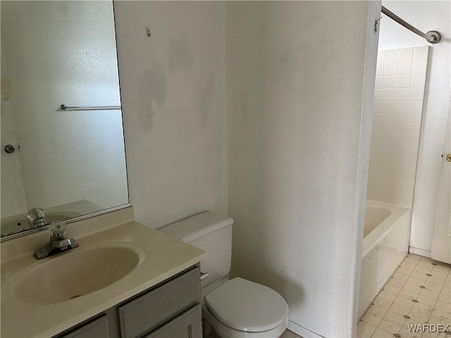 bathroom featuring shower / bath combination, vanity, and toilet