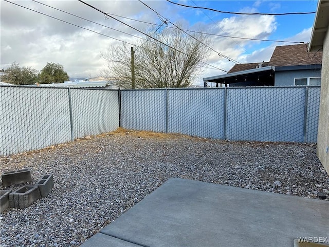 view of yard featuring a patio and a fenced backyard