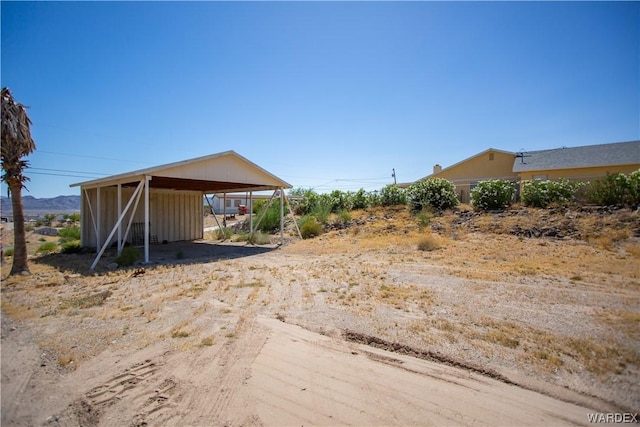 view of yard with a carport