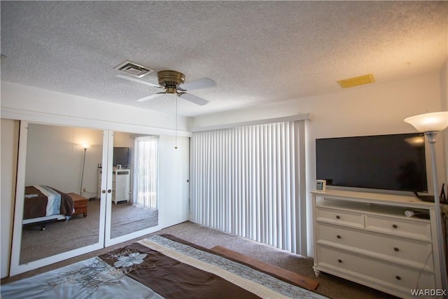 bedroom with visible vents and a textured ceiling
