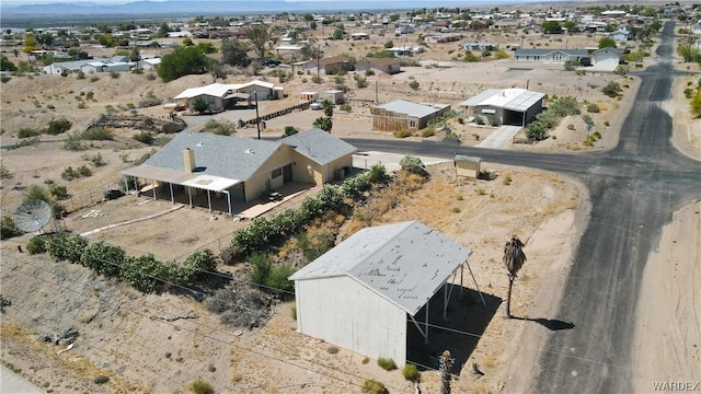 birds eye view of property with a mountain view and a desert view