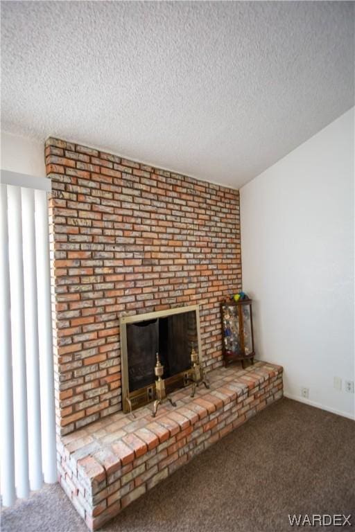 details featuring carpet, a brick fireplace, and a textured ceiling