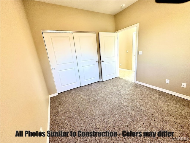 unfurnished bedroom with a closet, carpet flooring, and baseboards