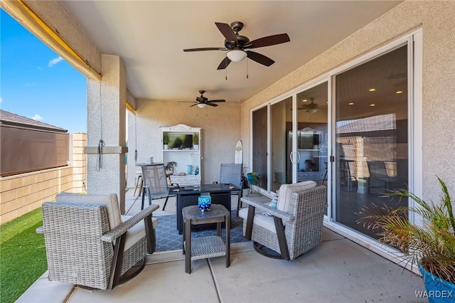 view of patio with ceiling fan and an outdoor living space