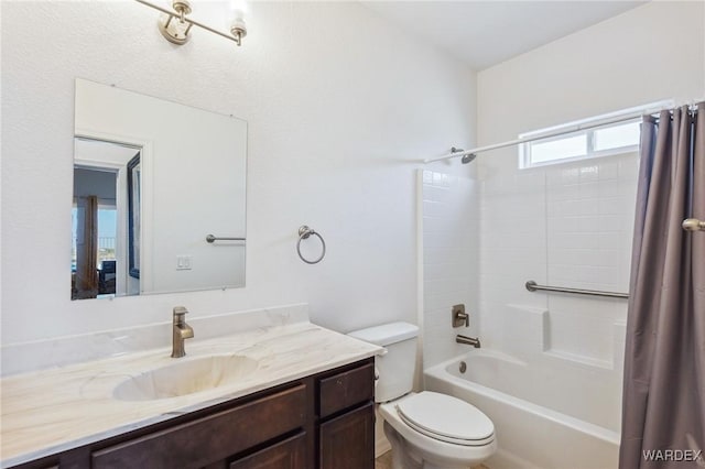 full bathroom with shower / bath combination with curtain, vanity, and toilet