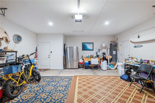 garage featuring freestanding refrigerator and water heater