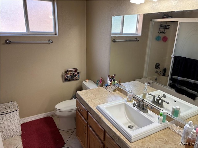 full bathroom featuring baseboards, tile patterned floors, toilet, and vanity