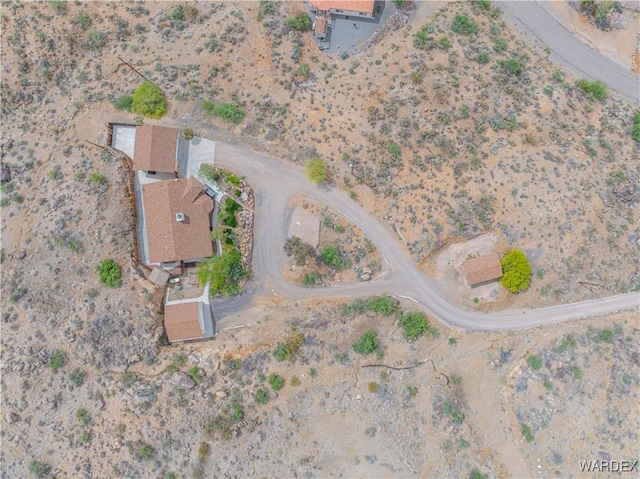 birds eye view of property with a desert view