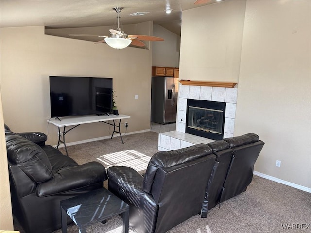 living area featuring ceiling fan, vaulted ceiling, light carpet, and baseboards