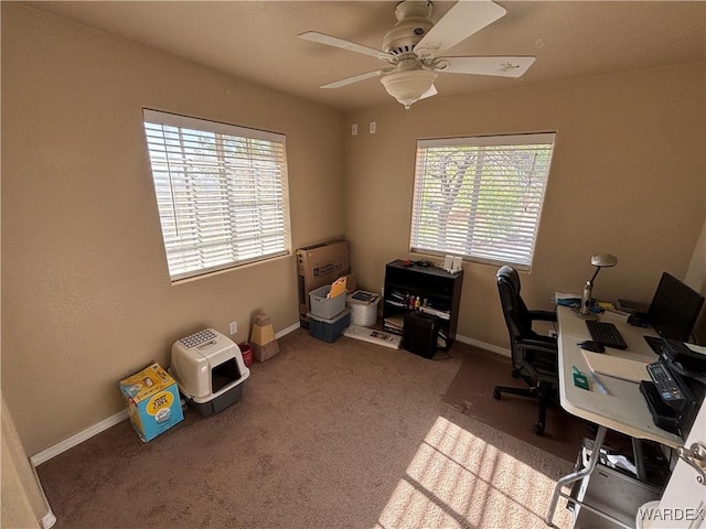 home office featuring a ceiling fan, carpet floors, and baseboards