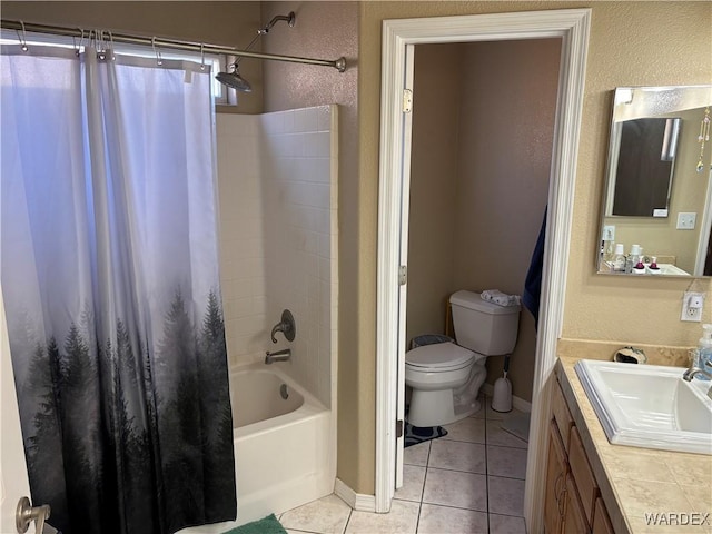 full bath with tile patterned flooring, toilet, vanity, baseboards, and shower / tub combo with curtain