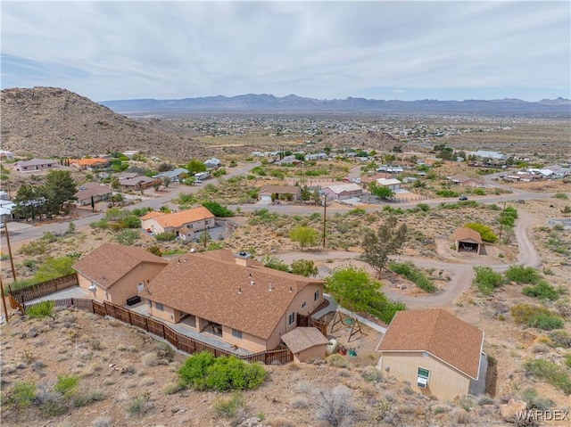 bird's eye view featuring a residential view, a mountain view, and a desert view