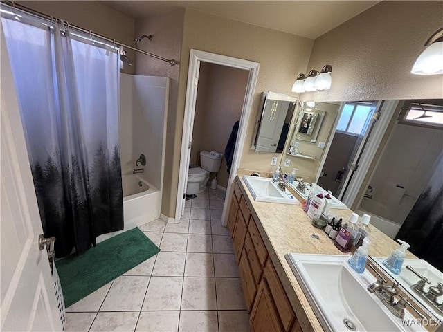 full bathroom with shower / tub combo with curtain, toilet, tile patterned flooring, and a sink