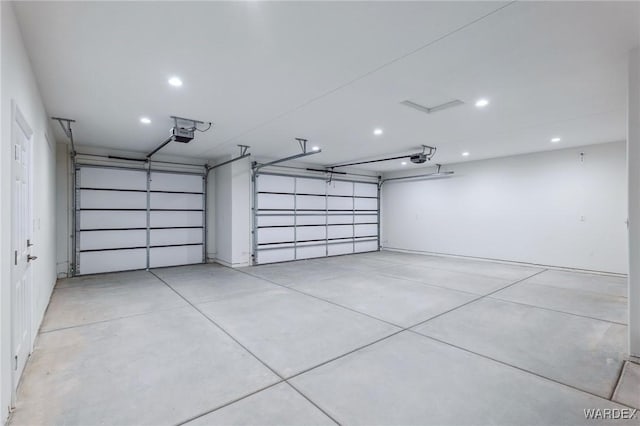 garage featuring recessed lighting and a garage door opener