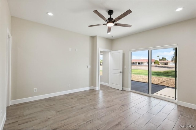 spare room with light wood-style floors, ceiling fan, baseboards, and recessed lighting