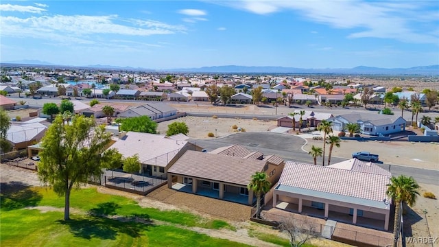 birds eye view of property with a residential view and a mountain view