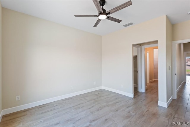 unfurnished bedroom with baseboards, visible vents, ceiling fan, and light wood finished floors