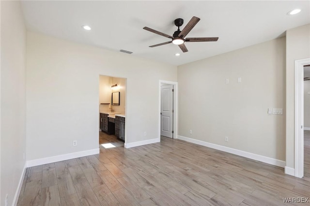 unfurnished bedroom with light wood-type flooring, baseboards, visible vents, and recessed lighting