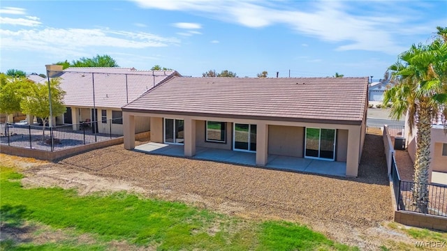 back of property featuring a patio area, fence, and stucco siding