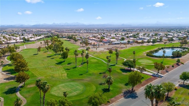 aerial view with a residential view, a mountain view, and golf course view