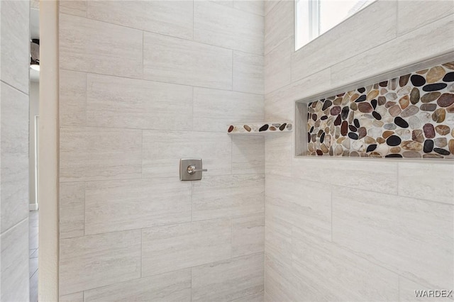 bathroom with tiled shower