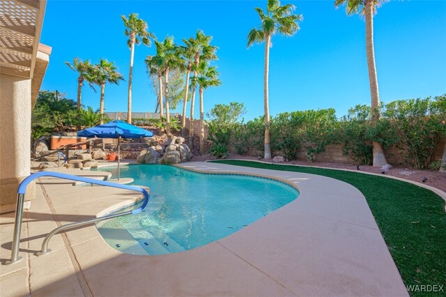 view of swimming pool with a fenced backyard, a fenced in pool, and a patio