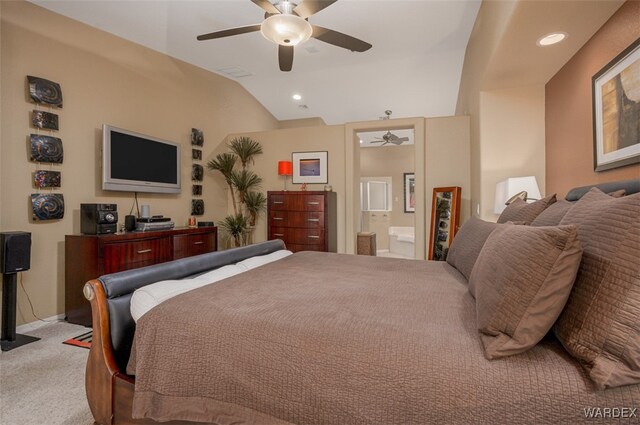 bedroom featuring light carpet, ensuite bath, recessed lighting, and lofted ceiling