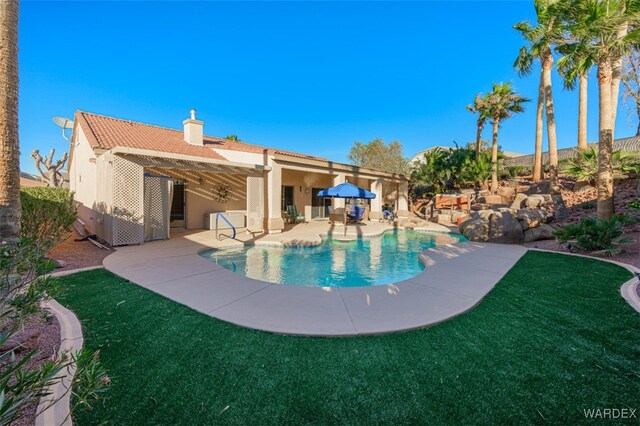 outdoor pool featuring a patio