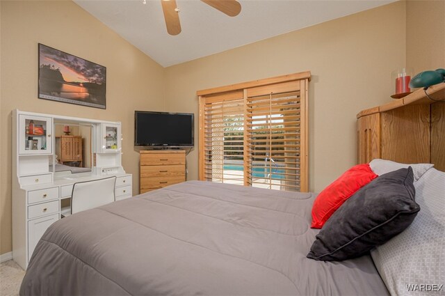 carpeted bedroom featuring lofted ceiling, baseboards, and a ceiling fan