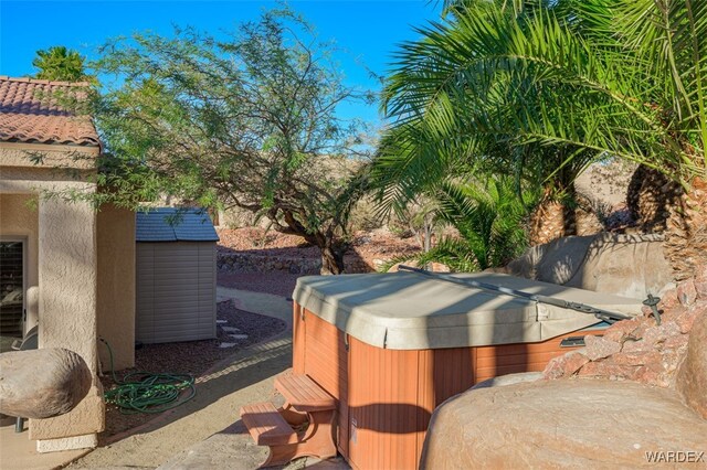 exterior space with a hot tub