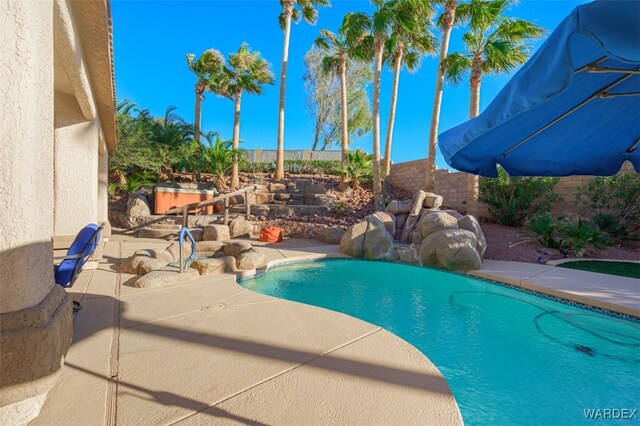 view of pool featuring a fenced backyard and a fenced in pool