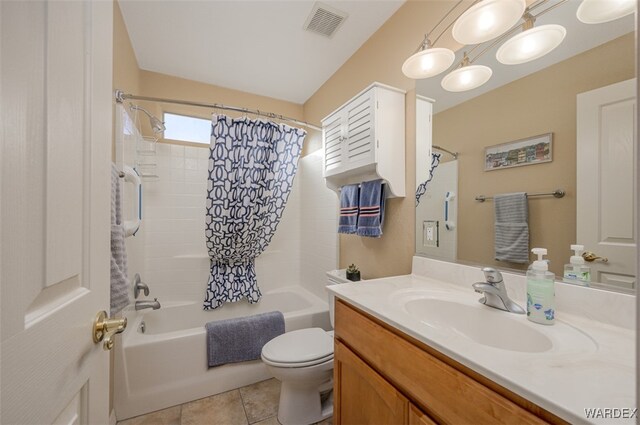 bathroom featuring visible vents, toilet, shower / bath combo with shower curtain, vanity, and tile patterned floors