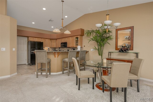 dining space featuring baseboards, visible vents, light colored carpet, lofted ceiling, and recessed lighting