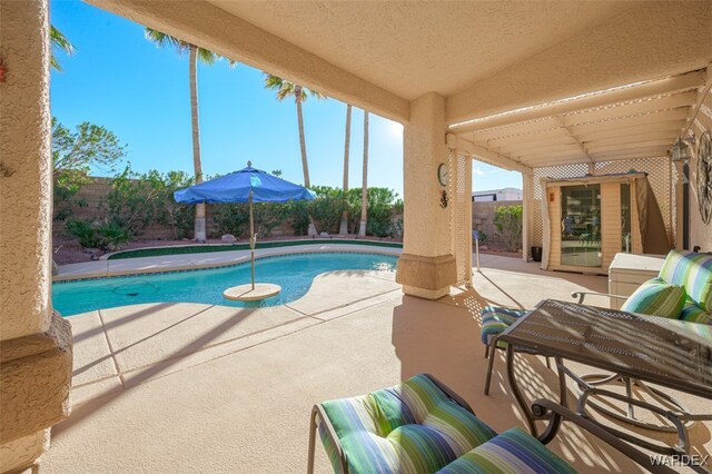 view of swimming pool featuring a fenced in pool, a patio area, and a fenced backyard