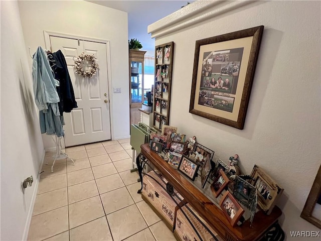 entrance foyer with light tile patterned floors