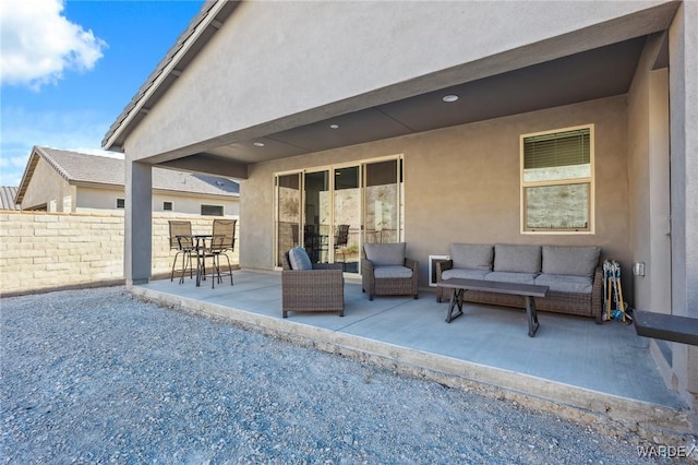 view of patio / terrace with outdoor lounge area and fence