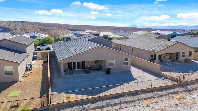 drone / aerial view with a residential view and a mountain view