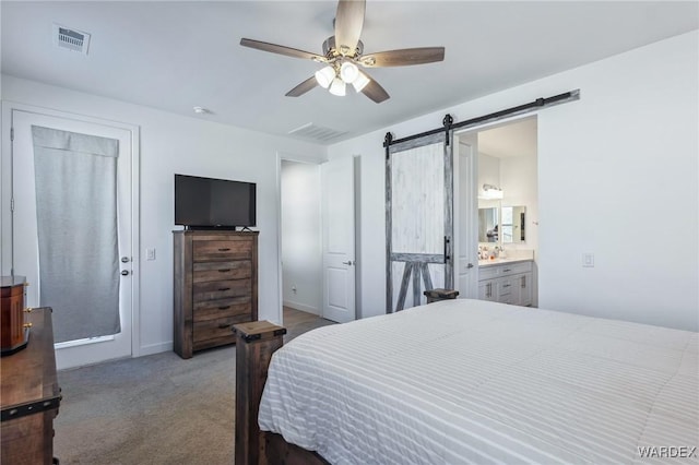 bedroom with light carpet, a barn door, visible vents, and a ceiling fan