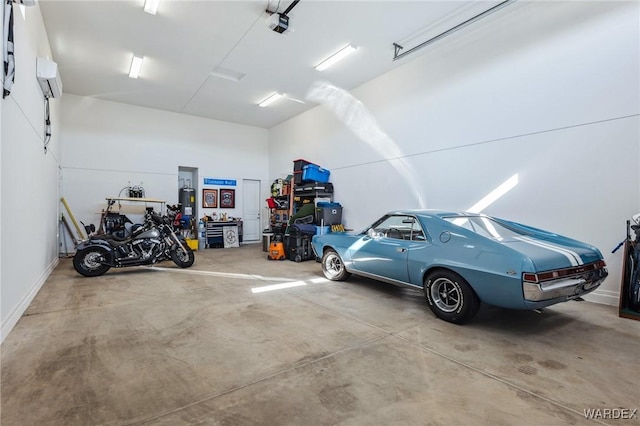 garage featuring water heater and a garage door opener